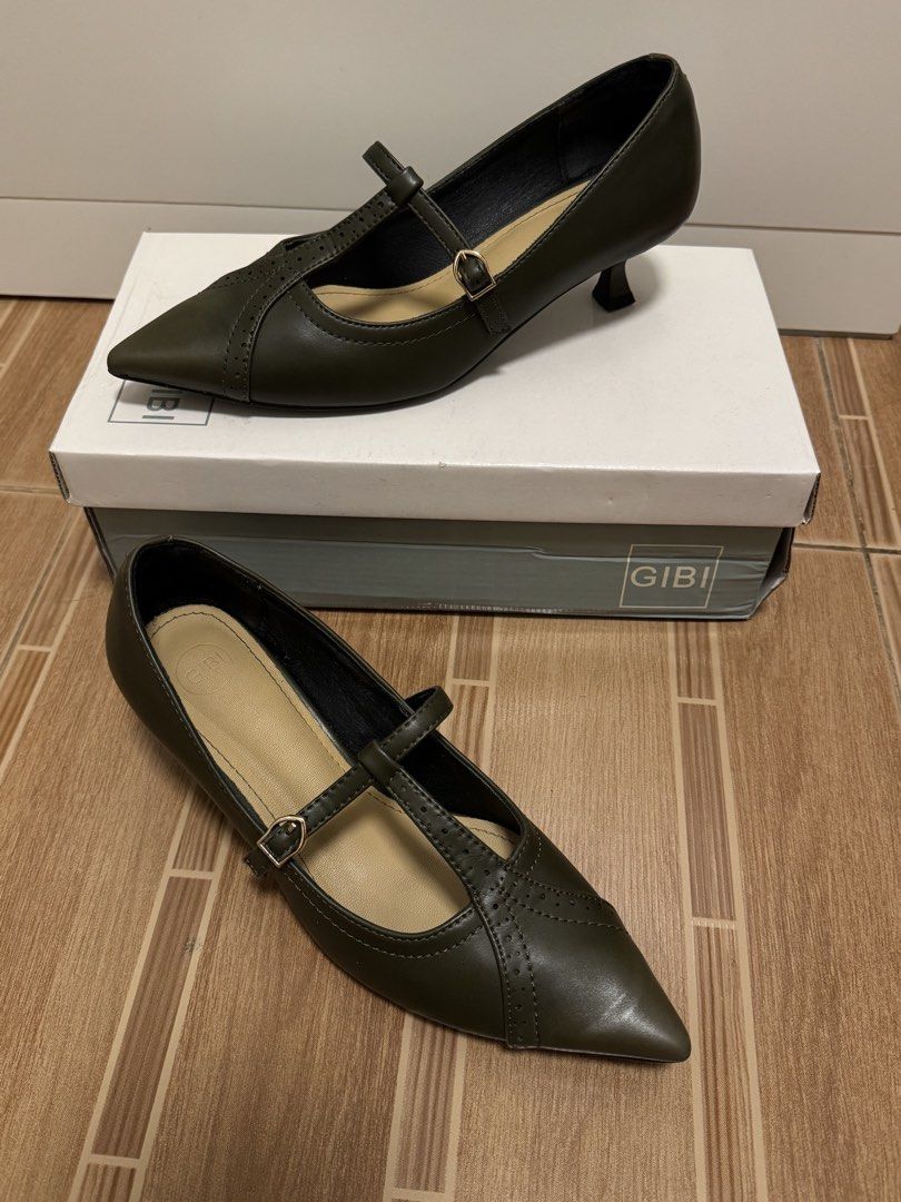Gibi Olive Kitten Heels Size 36 (Category: Heels) located in Manila. Submitted by dianesls_13 (Listing ID 1467382928, Image 2). Description: - Brand: Gibi - Style: Kitten heels with pointed toe, T-strap design, and buckle closure - Color: Olive Green - Size: 36 - Condition: Like new, used only once for an event, pristine condition - Inclusions: Original box included (Retail price: ₱1,999) - Comfort: Low heel, ideal for everyday use.