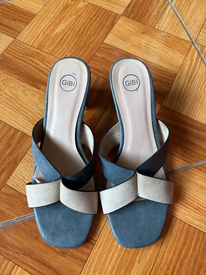 Gibi Thalie Two-Tone Block Heels Size 37 (Category: Heels) located in Balayan. Submitted by authenticfindsbymrb (Listing ID 1467420123, Image 1). Description: - Brand: Gibi (Style: Thalie) - Size: 37 - Design: Two-tone dark grey and light beige crisscross straps with a modern square toe - Comfort: Stable chunky block heel for comfortable height - Condition: Soles show minor wear from previous use, but straps and insoles are fully intact and well-