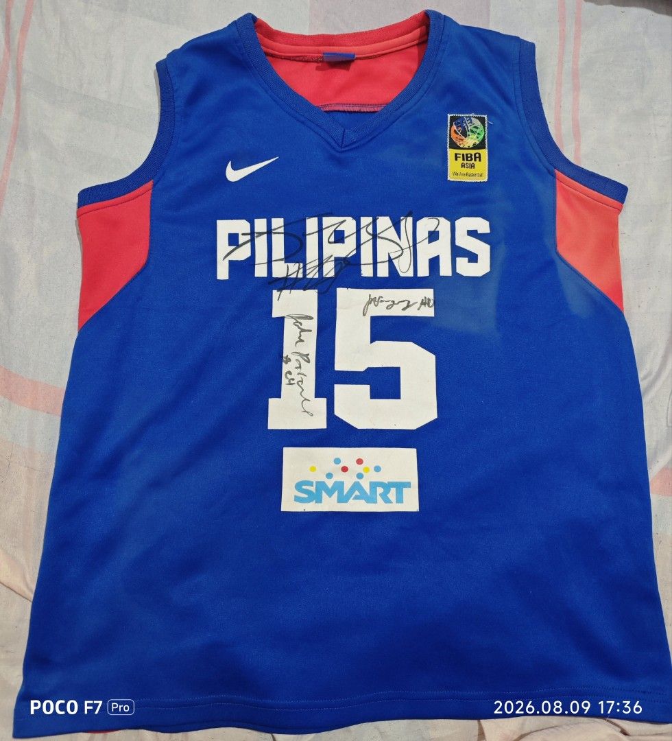 Gilas Pilipinas Marc Pingris Signed Jersey Size 15 (Category: Activewear) located in Manila. Submitted by ross.jeremy (Listing ID 1467599079, Image 1). Description: - Gilas Pilipinas Home Jersey (Marc Pingris #15) - Color: Blue with red side panels and Philippine sunburst design on the back - Authentic details: Nike swoosh, FIBA Asia patch, and Smart sponsor logo - Rare collector's piece: Multi-signed by players across the front and back - Condit