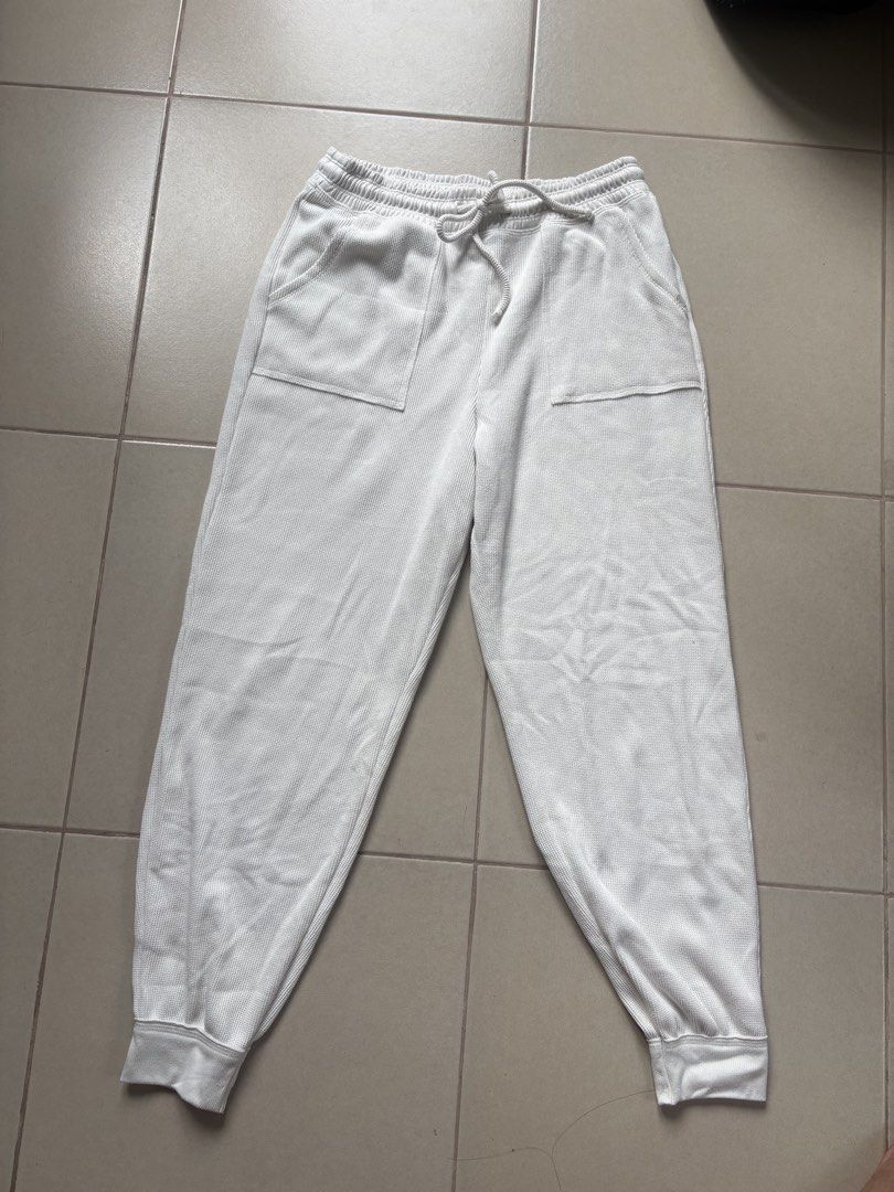 Gilly Hicks White Waffle Knit Joggers M (Category: Joggers) located in Quezon City. Submitted by therealpaulsebastian.910 (Listing ID 1467370461, Image 1). Description: - Brand: Gilly Hicks - Item: Waffle Knit Joggers - Color: Clean White - Size: Medium (Made in Sri Lanka) - Material: Soft textured waffle knit fabric - Features: Elastic waistband with drawstring, front patch pockets, cuffed ankles - Condition/Vibe: Great casual lounging piece.