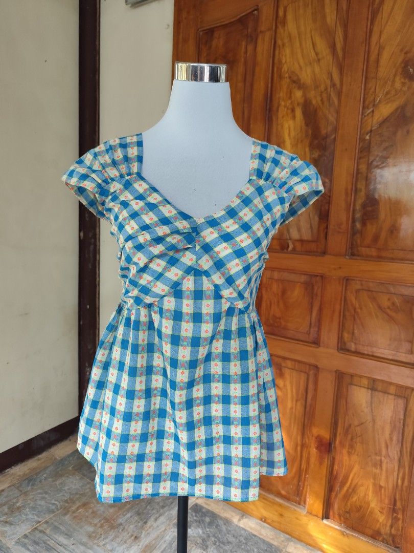 Gingham Floral Doll Top (Category: Blouses) located in Tacloban City. Submitted by _venta_segunda (Listing ID 1467370611, Image 1). Description: No flaws Bust 34-36 Smocked at the back.