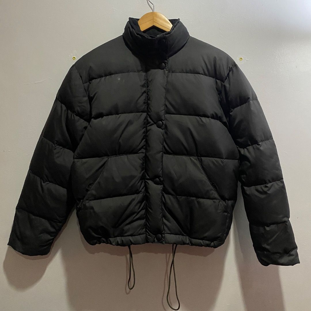 Giorgio Armani Puffer Down Jacket M (Category: Coats, Jackets and Outerwear) located in Antipolo. Submitted by bentakahitanoano (Listing ID 1467577431, Image 1). Description: This piece is a vintage Armani Jeans black quilted puffer jacket. It features a distinctive high stand-up collar, front snap-button closures over a central placket, slanted side hand pockets, and adjustable elastic drawstrings hanging at the hem. Still in good condition Best