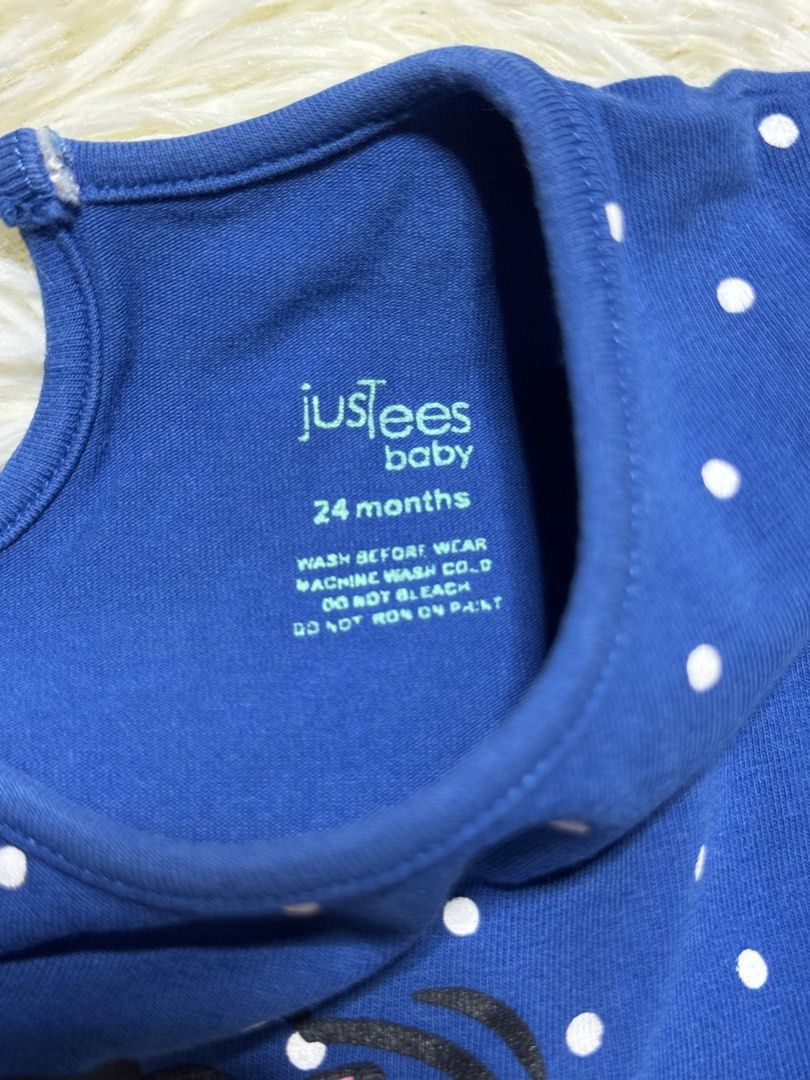girl top (Category: Babies & Kids Fashion) located in Dagupan City. Submitted by iamrannflores (Listing ID 1467409895, Image 2). Description: - Brand/Size: justees baby, Size 24 Months - Design: Blue with white polka dots and 'MOM'S SUPER GIRL' graphic in the center - Details: Short flutter sleeves with ruffled edges and back button closure - Material/Care: Machine wash cold (instructions printed inside) - Condition: Excellent, like new - Perfect