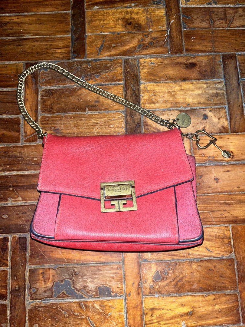 Givenchy GV3 Red Leather Shoulder Bag (Category: Luxury Bags & Wallets) located in Mandaluyong City. Submitted by copthatgirl (Listing ID 1467480823, Image 1). Description: - Brand: Givenchy - Material: Premium bright red leather - Hardware: Gold-tone chain strap, front closure, and interior logo plate - Interior: Multiple compartments with a secure zipped pocket - Design: Compact structured shape with stylish side gussets - Extras: Includes hang