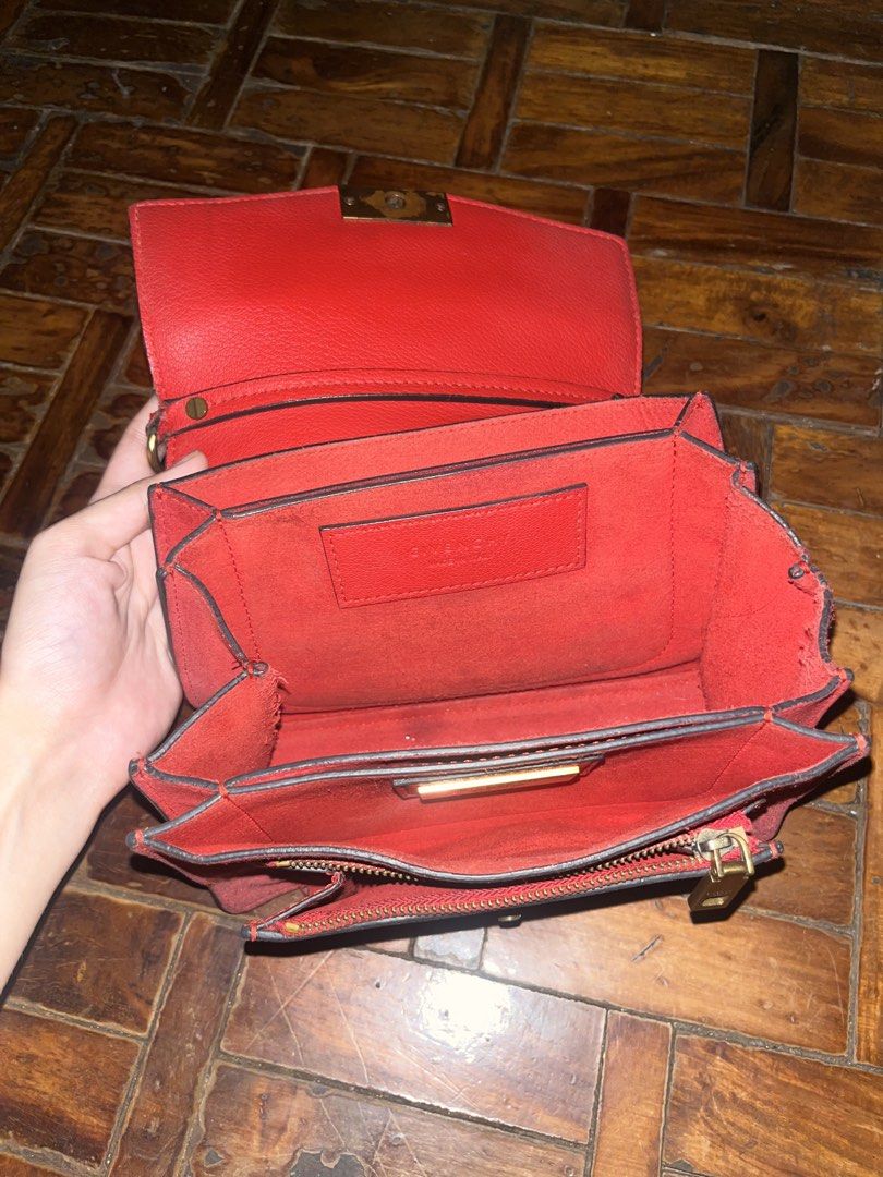 Givenchy GV3 Red Leather Shoulder Bag (Category: Luxury Bags & Wallets) located in Mandaluyong City. Submitted by copthatgirl (Listing ID 1467480823, Image 3). Description: - Brand: Givenchy - Material: Premium bright red leather - Hardware: Gold-tone chain strap, front closure, and interior logo plate - Interior: Multiple compartments with a secure zipped pocket - Design: Compact structured shape with stylish side gussets - Extras: Includes hang
