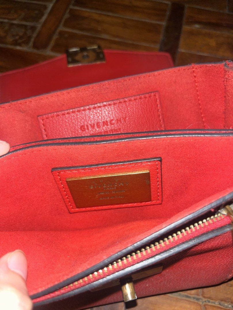 Givenchy GV3 Red Leather Shoulder Bag (Category: Luxury Bags & Wallets) located in Mandaluyong City. Submitted by copthatgirl (Listing ID 1467480823, Image 2). Description: - Brand: Givenchy - Material: Premium bright red leather - Hardware: Gold-tone chain strap, front closure, and interior logo plate - Interior: Multiple compartments with a secure zipped pocket - Design: Compact structured shape with stylish side gussets - Extras: Includes hang