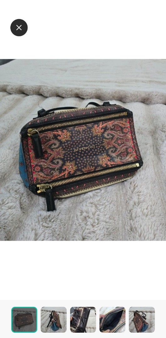 Givenchy Paisley Print Pandora Bag (Category: Luxury Bags & Wallets) located in Santo Tomas. Submitted by bonita0219 (Listing ID 1467387444, Image 1). Description: - Brand: Givenchy - Style: Pandora Bag - Material: Fabric with black leather trim and blue denim side panels - Design: Intricate paisley print with gold-tone zippers - Compartments: Dual zip compartments across the top - Shape: Structured rectangular shape - Condition: Excellent, well-