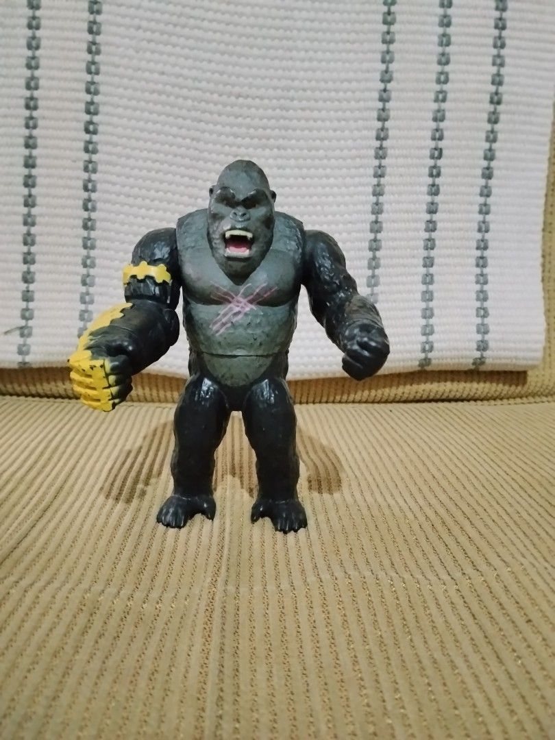 Godzilla x Kong Empire Kong Action Figure (Category: Figurines & Statues) located in Quezon City. Submitted by mallow_surplus_shop (Listing ID 1467384331, Image 3). Description: - Character: Kong from Godzilla x Kong: The New Empire - Condition: Loose figure, stands on its own (no original packaging) - Details: Detailed sculpt, open mouth with teeth, distinct pink chest scar, and iconic yellow bionic gauntlet on right arm - Perfect for: Monsterve