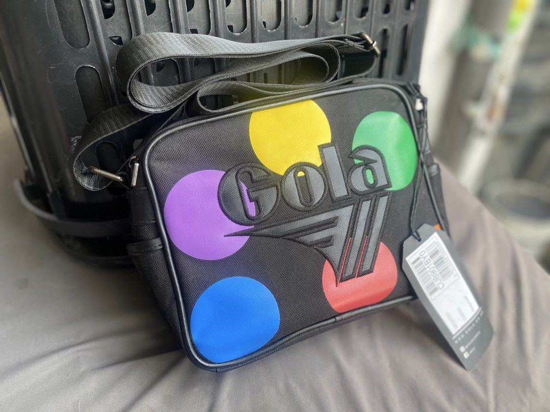 Gola Redgrave Dot Crossbody Bag Black Multi (Category: Cross-body Bags) located in San Jose del Monte. Submitted by gigjhoe (Listing ID 1467396482, Image 2). Description: -Dimes: 9.5 x 7.5 x 3” - Brand: Gola - Style: Crossbody bag with zipper closure - Design: Black base with colorful polka dots and a large embroidered front logo - Strap: Adjustable black shoulder strap - Condition: Brand new with tags still attached - Features: Fun, spacious, an