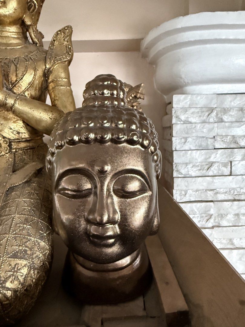 Gold Buddha Head Statue Decor (Category: Figurines & Statues) located in Manila. Submitted by chestercor71092 (Listing ID 1467433500, Image 1). Description: - Elegant gold-colored Buddha head sculpture on a sturdy round stand - Features traditional curled hair and a calm, serene expression with closed eyes - Medium size, lightweight resin material with a sleek metallic finish - Ideal decor piece for meditation spaces, living room shelves, or tabl
