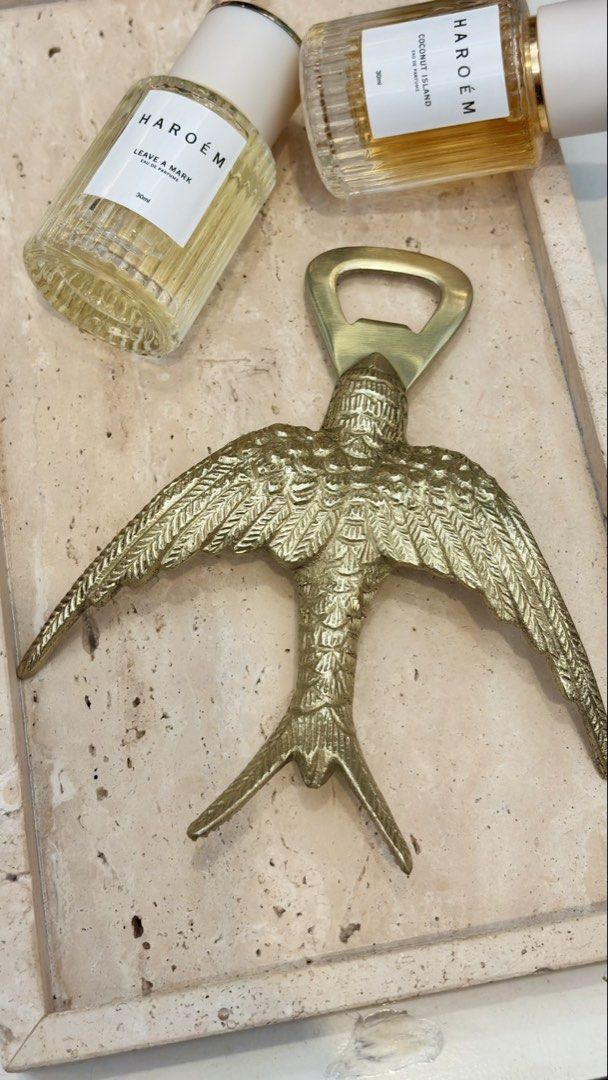 Gold Swallow Bird Bottle Opener (Category: Vintage Collectibles) located in Manila. Submitted by globetrotter143 (Listing ID 1467450852, Image 1). Description: - Elegant design: Gold-toned brass flying swallow with detailed feather engraving - Functional: Head section acts as a sturdy bottle cap lifter - Durable: Heavy metal construction providing a solid grip - Condition: Solid finish with no major scratches or dents - Versatile: Great for kitch