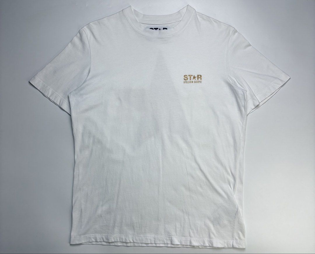 Golden Goose Star Tee (Category: Shirts) located in Cavite. Submitted by sc_rcity (Listing ID 1467484948, Image 3). Description: Tagged Size : Small Women’s Authentic ( Scannable NFC ) Made in Italy Flaw : Slight detached glitter print on back print. Barely noticeable. No Inclusion Note : please manage your expectation since this is a white tee. Measurements: in inches ( approx. ) Width 20 Length 27 Shoulder 17 Sleeve 8.5.