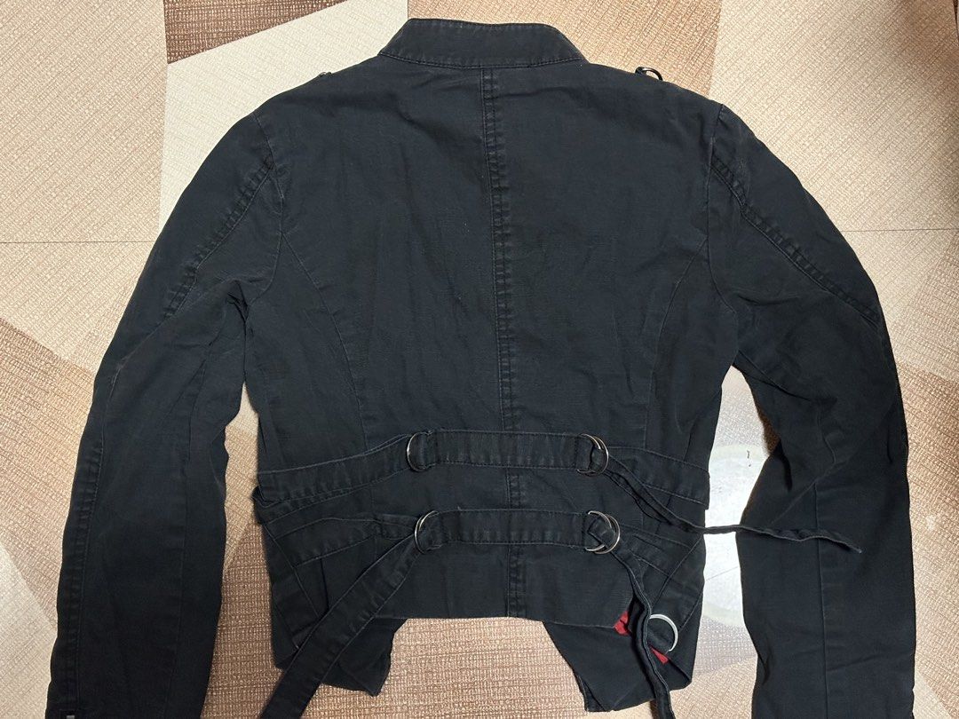 Gothic Punk Asymmetrical Multi-Zip Rider Jacket (Category: Coats, Jackets and Outerwear) located in Baguio. Submitted by littlearchive (Listing ID 1467543916, Image 3). Description: Asymmetric main zipper, multi-zipper pocket details, tactical D-ring metal accents on shoulders and sleeves, bold contrasting red inner lining, standing mandarin moto collar with silver snap buttons, belt loop waist ties. bust: 16" length: 19" sleeve length: 26" fits 