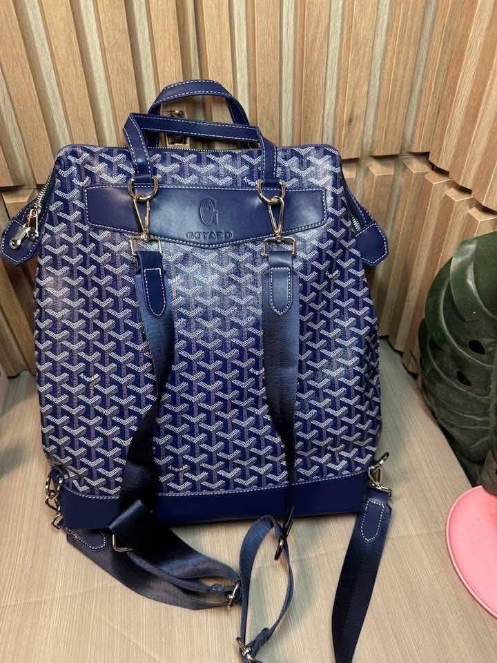 Goyard Blue Monogram Backpack with Yellow Interior (Category: Backpacks) located in Manila. Submitted by goodbuying_items0211 (Listing ID 1467404463, Image 2). Description: - Style: Blue monogram backpack with stylish white stitching - Material & Accents: Solid blue leather trim, top handle, and durable metal hardware - Straps: Adjustable dark shoulder straps for a comfortable fit - Closure: Secure top zipper closure - Interior: Vibrant yellow fa