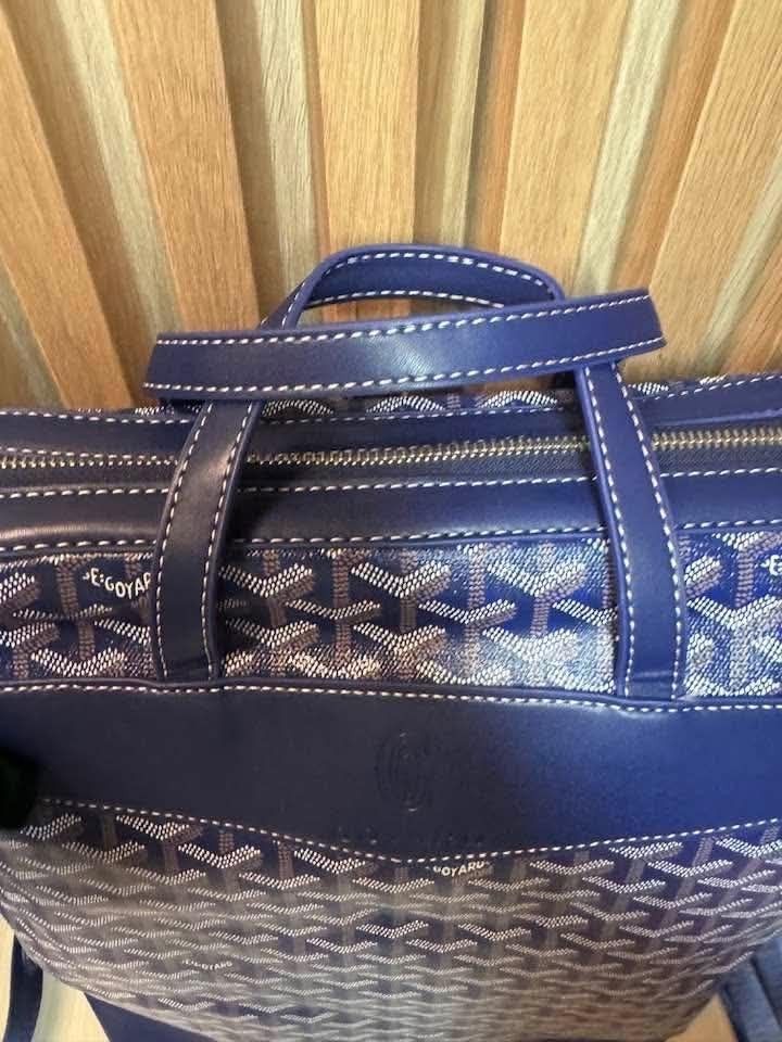 Goyard Blue Monogram Backpack with Yellow Interior (Category: Backpacks) located in Manila. Submitted by goodbuying_items0211 (Listing ID 1467404463, Image 3). Description: - Style: Blue monogram backpack with stylish white stitching - Material & Accents: Solid blue leather trim, top handle, and durable metal hardware - Straps: Adjustable dark shoulder straps for a comfortable fit - Closure: Secure top zipper closure - Interior: Vibrant yellow fa