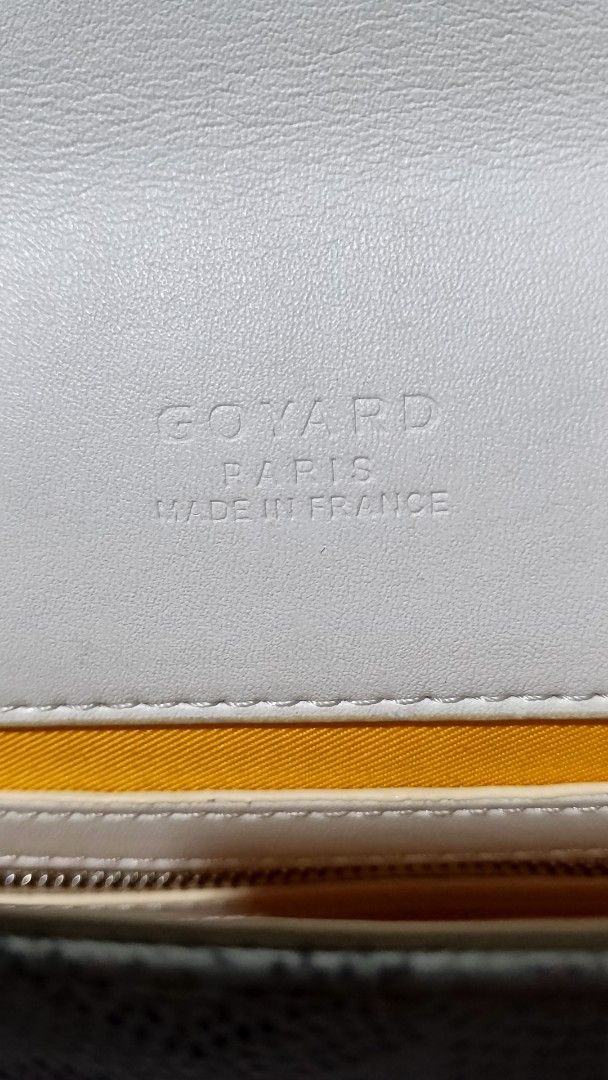 Goyard White Monogram Crossbody Shoulder Bag (Category: Luxury Bags & Wallets) located in Manila. Submitted by thriftnijuls (Listing ID 1467481966, Image 3). Description: - Brand: Goyard - Style: Crossbody bag - Color: White with signature chevron canvas pattern and leather trim - Hardware: Gold-tone - Closure: Double buckle flap - Interior: Yellow lining with stamped Goyard Paris Made in France logo - Details: Adjustable shoulder strap with stam