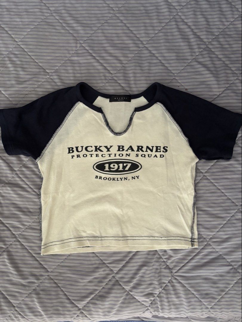 Grande "Bucky Barnes Protection Squad" Raglan Crop Top (Category: Others Tops) located in Calapan. Submitted by shop_storeal (Listing ID 1467413220, Image 1). Description: Brand: GRANDE (Made in Korea) Size: Fits Small to Semi-Medium (Crop fit) Condition: Excellent Preloved Condition Width: 15 in Length: 15 in MOP: Gcash, GoTyme MOD: J&T.