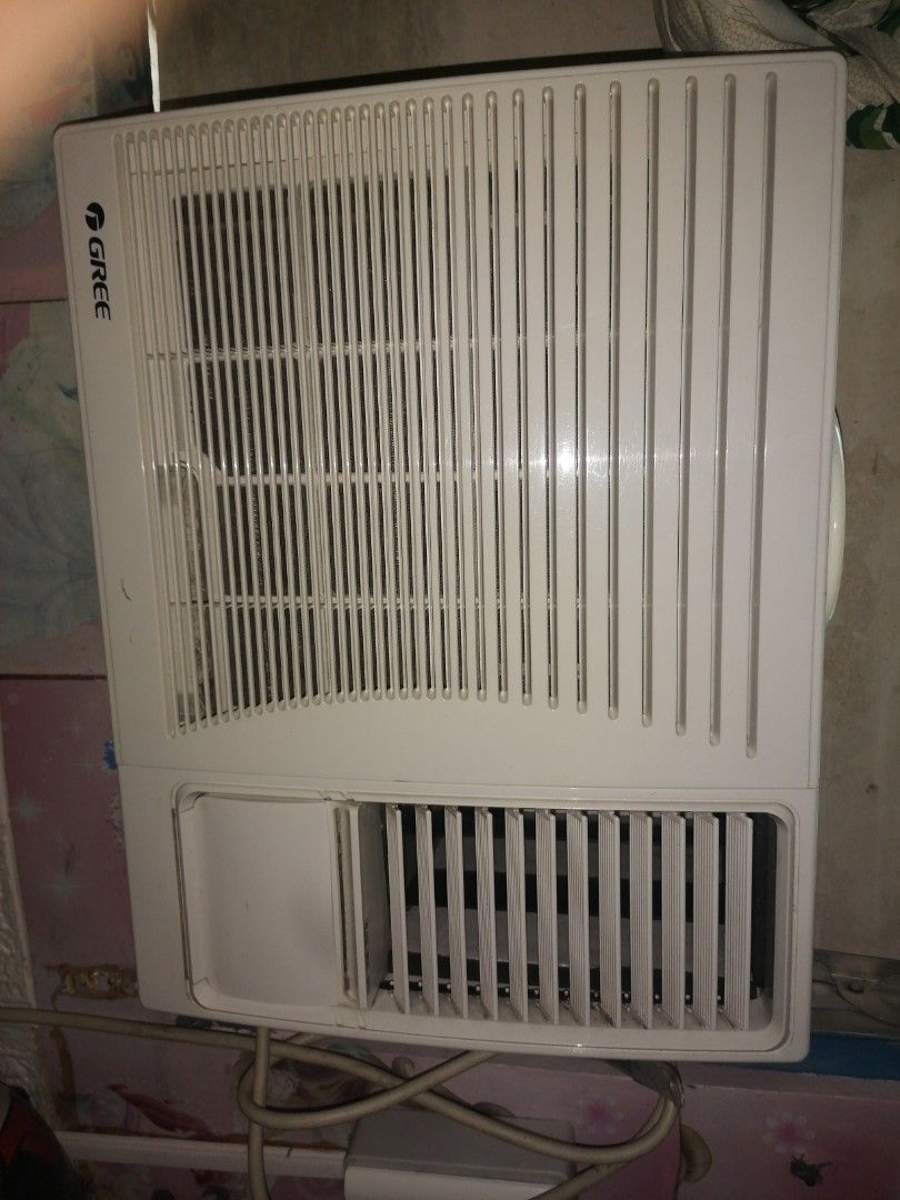GREE Window Type Air Conditioner (Category: Air Conditioning and Heating) located in Manila. Submitted by yzekielss27217 (Listing ID 1467370421, Image 1). Description: - Brand: GREE Window Air Conditioner - Color: Clean white finish - Controls: Dual rotary knobs for easy thermostat and fan speed adjustment - Airflow: Adjustable louvers for horizontal and vertical direction - Performance: Cools rooms quickly and effectively - Setup: Standard windo