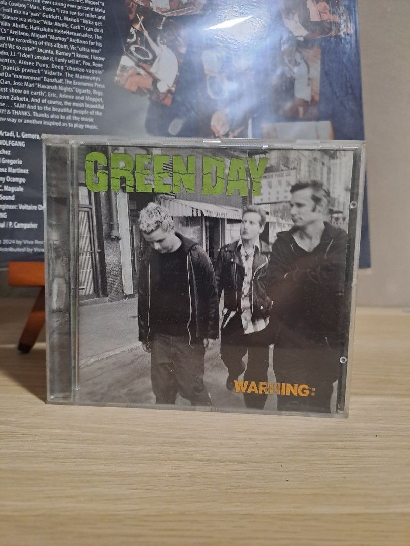 Green Day Warning CD Album (Category: CDs & DVDs) located in Las Pinas. Submitted by cobieshop (Listing ID 1467508466, Image 1). Description: - Item: Green Day Warning CD - Condition: Disc plays perfectly; jewel case shows standard storage wear - Notable Tracks: Minority, Waiting - Perfect for rock music fans and collectors - Ships securely from the Philippines.