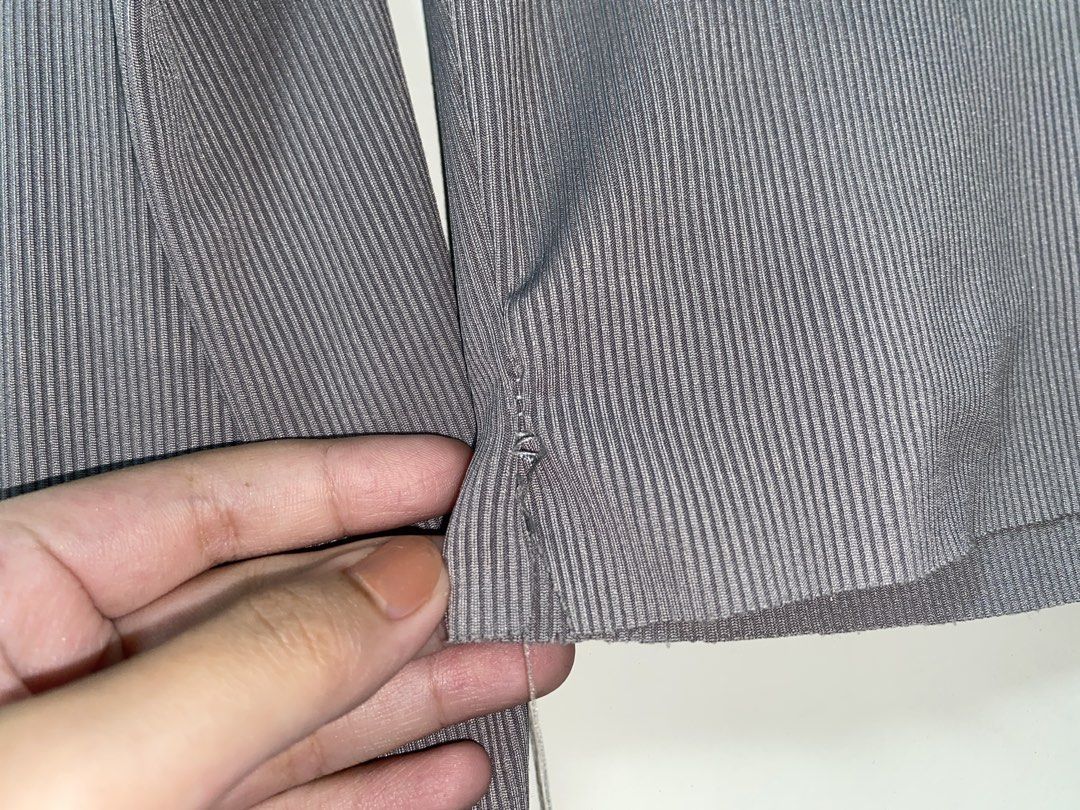 Grey Ribbed V-Neck Button-Up Crop Top Cardigan (Category: Longsleeves) located in Manila. Submitted by quickeagle.521fc7 (Listing ID 1467384872, Image 3). Description: Grey ribbed knit cardigan, long sleeves. V-neck cut with white front buttons. Cropped length, nice basic piece for layering. Light wear on the bottom hem stitching, still in decent shape overall. Soft stretchy material..