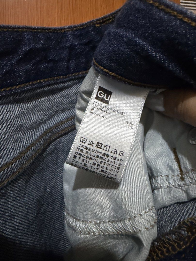 GU Dark Blue Denim Jeans (Category: Jeans) located in Muntinlupa City. Submitted by biancaagbscloset (Listing ID 1467537795, Image 2). Description: - Brand: GU - Style: Classic straight leg jeans - Color: Solid dark blue wash - Material: 99% cotton, 1% polyurethane - Closure: Standard button and zipper - Pockets: Functional front pockets - Style Code: 221-349753 - Condition: Excellent, versatile wardrobe staple.