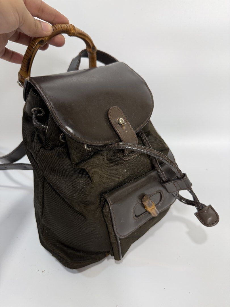 Gucci Bamboo Nylon Mini Backpack (Category: Backpacks) located in Dasmarinas. Submitted by arjalaph (Listing ID 1467474540, Image 1). Description: - Handle: Unique bamboo top handle - Closure: Drawstring top under a flap cover with push-lock hardware & front turn-lock pocket -check all the photos -project bag.