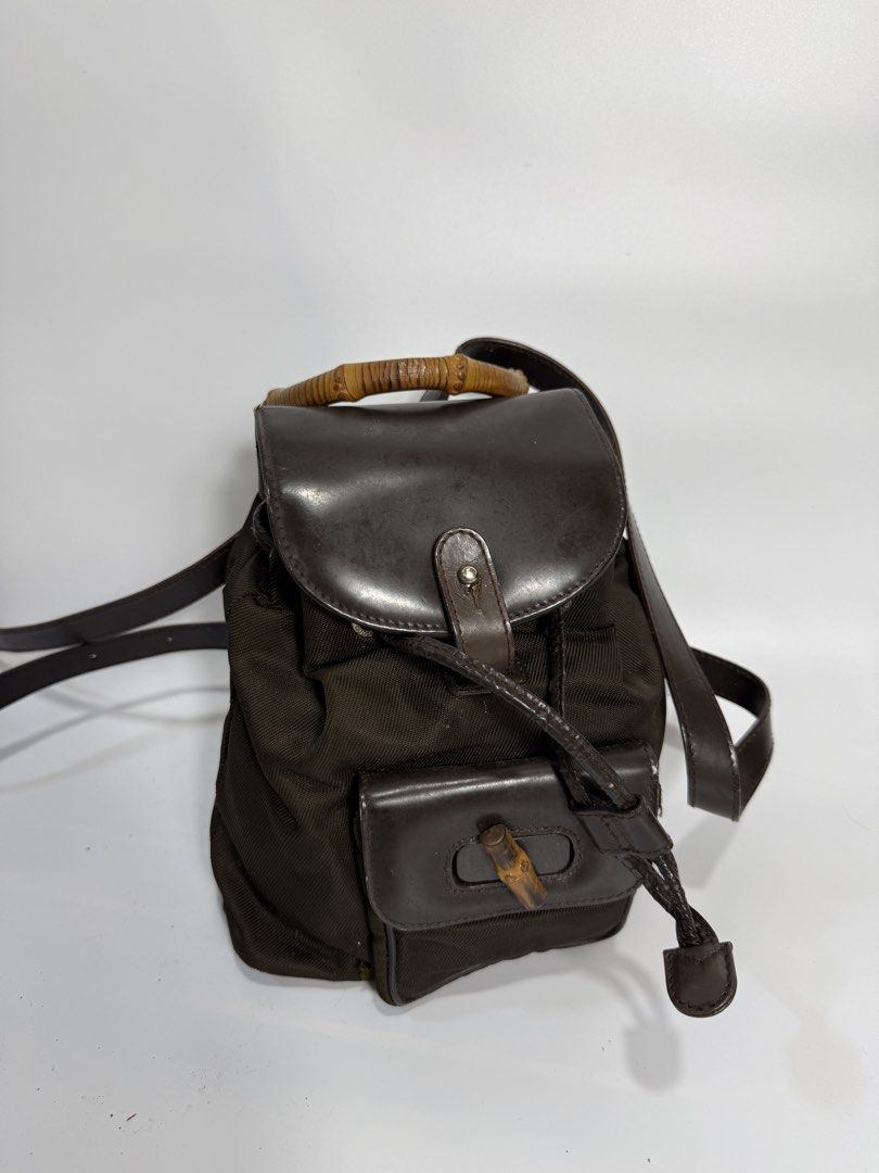 Gucci Bamboo Nylon Mini Backpack (Category: Backpacks) located in Dasmarinas. Submitted by arjalaph (Listing ID 1467474540, Image 2). Description: - Handle: Unique bamboo top handle - Closure: Drawstring top under a flap cover with push-lock hardware & front turn-lock pocket -check all the photos -project bag.