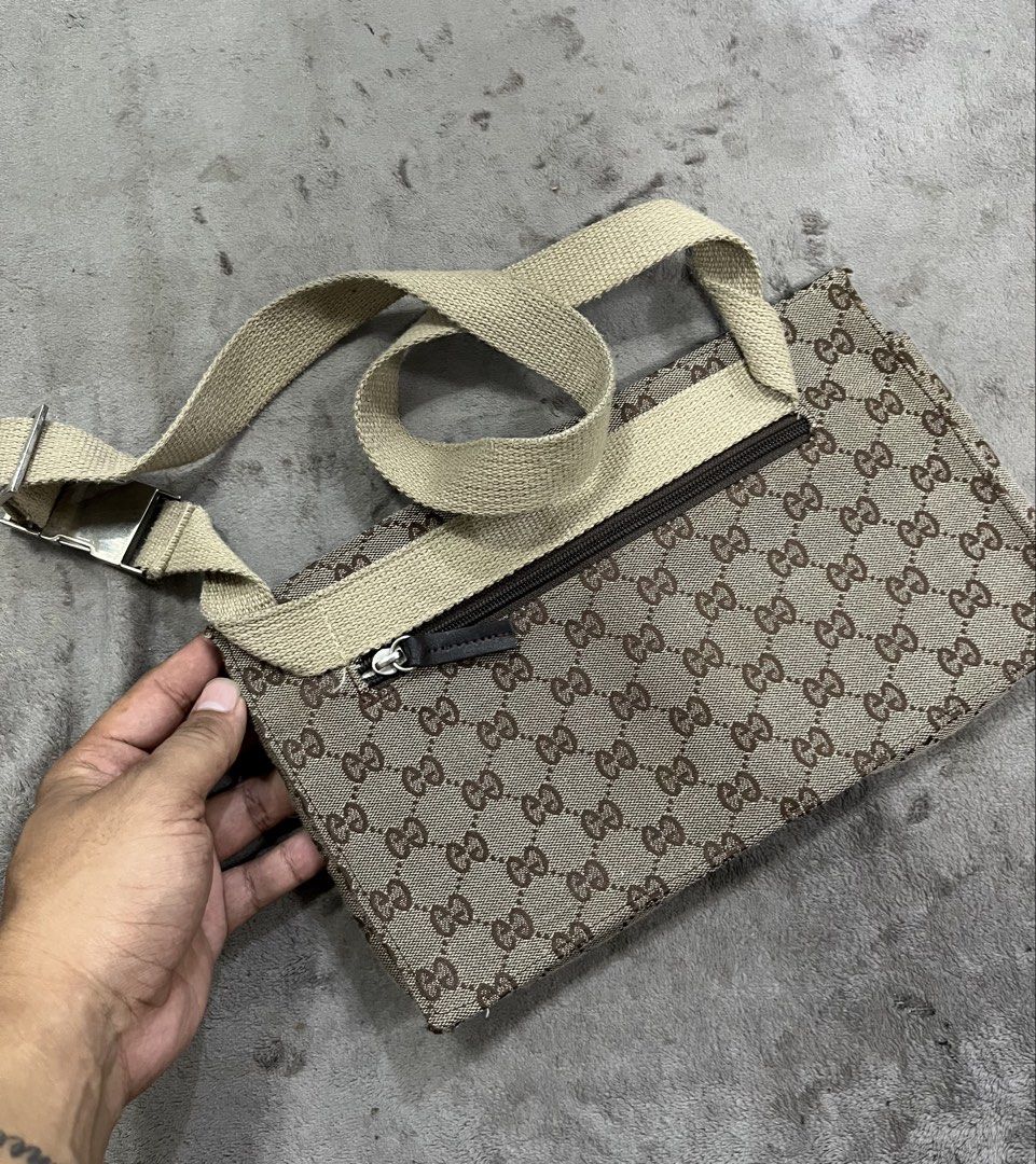 Gucci GG Monogram Double Pocket Belt Bag (Category: Belt bags, Clutches and Pouches) located in General Trias. Submitted by zrchustle.604 (Listing ID 1467485851, Image 2). Description: Gucci GG Monogram Double Pocket Belt Bag (or waist/shoulder bumbag) crafted from beige and ebony GG canvas with dark brown leather trim and silver-tone hardware. OFF ONLY.
