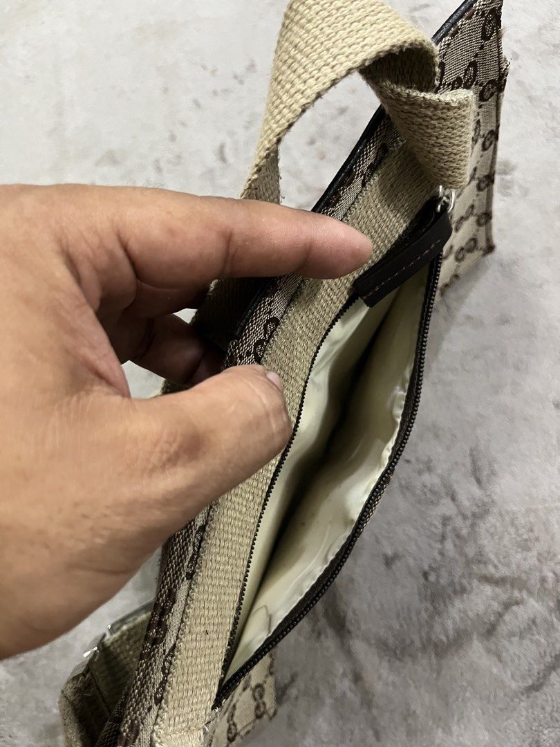 Gucci GG Monogram Double Pocket Belt Bag (Category: Belt bags, Clutches and Pouches) located in General Trias. Submitted by zrchustle.604 (Listing ID 1467485851, Image 3). Description: Gucci GG Monogram Double Pocket Belt Bag (or waist/shoulder bumbag) crafted from beige and ebony GG canvas with dark brown leather trim and silver-tone hardware. OFF ONLY.