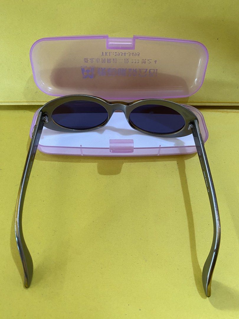 Gucci Oval Sunglasses Made in Italy (Category: Sunglasses & Eyewear) located in Baguio. Submitted by thrift_bonita (Listing ID 1467383749, Image 2). Description: - Brand: Gucci (Vintage) - Style: Oval frames in bronze - Lenses: Dark tinted - Hardware: Signature silver 'G' logo on both temples - Origin & Size: Made in Italy, Size 135 - Inclusions: Comes with a pink plastic storage case - Condition: Excellent pre-loved condition, 100% authentic - L