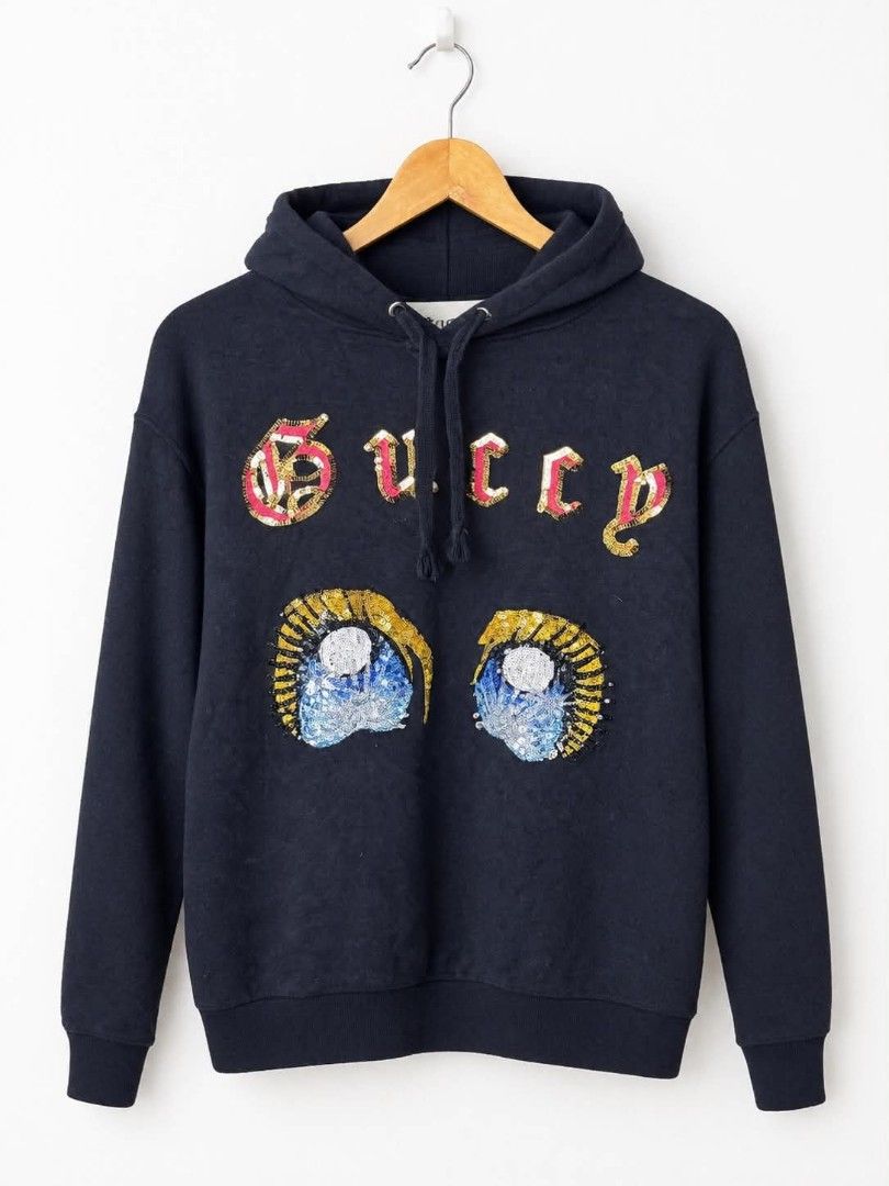 Gucci Sequin Embellished Hoodie Black (Category: Coats, Jackets and Outerwear) located in Pasig City. Submitted by dertah (Listing ID 1467509984, Image 1). Description: - Brand: Gucci - Color: Black - Design: Embroidered sequin graphics across the chest - Features: Drawstring hood, ribbed cuffs and hem - Origin: Made in Italy (label stitched inside collar) - Style: Classic pullover - Condition: Excellent / Pre-loved (ready to wear) - Mode of Paym