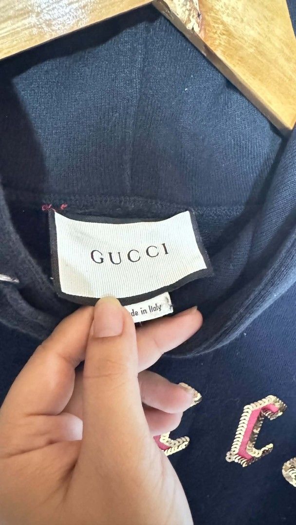 Gucci Sequin Embellished Hoodie Black (Category: Coats, Jackets and Outerwear) located in Pasig City. Submitted by dertah (Listing ID 1467509984, Image 2). Description: - Brand: Gucci - Color: Black - Design: Embroidered sequin graphics across the chest - Features: Drawstring hood, ribbed cuffs and hem - Origin: Made in Italy (label stitched inside collar) - Style: Classic pullover - Condition: Excellent / Pre-loved (ready to wear) - Mode of Paym