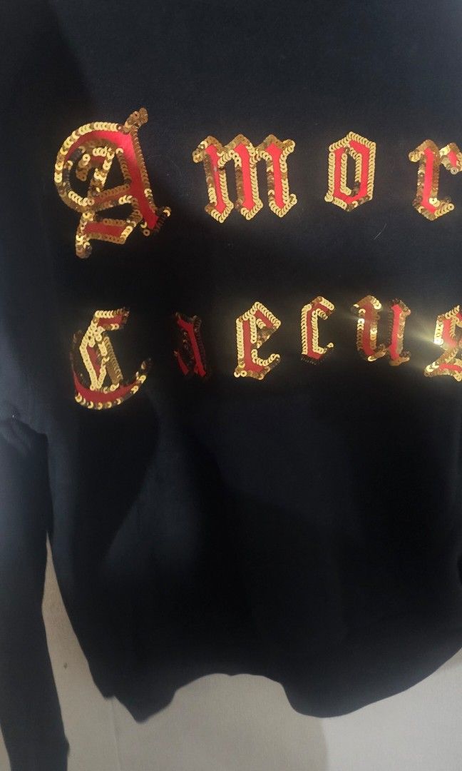 Gucci Sequin Embellished Hoodie Black (Category: Coats, Jackets and Outerwear) located in Pasig City. Submitted by dertah (Listing ID 1467509984, Image 3). Description: - Brand: Gucci - Color: Black - Design: Embroidered sequin graphics across the chest - Features: Drawstring hood, ribbed cuffs and hem - Origin: Made in Italy (label stitched inside collar) - Style: Classic pullover - Condition: Excellent / Pre-loved (ready to wear) - Mode of Paym