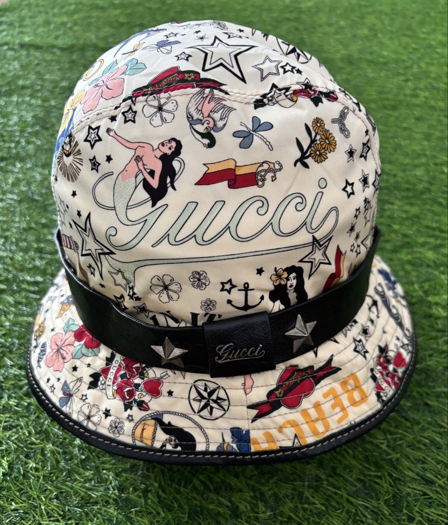 Gucci Tattoo Print Bucket Hat with Leather Strap (Category: Caps & Hats) located in Makati City. Submitted by rare_thrift_stuff (Listing ID 1467371346, Image 1). Description: Vintage Gucci Bucket hat rare Large on tag Issue sa loob see pics Dm.