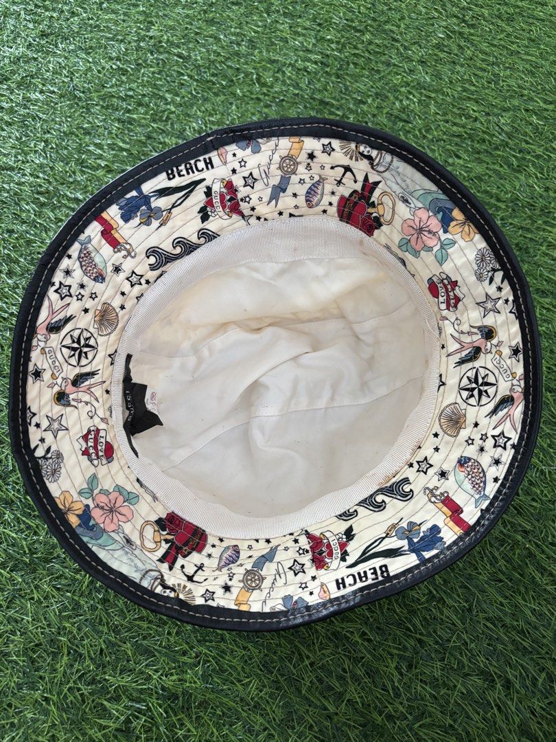 Gucci Tattoo Print Bucket Hat with Leather Strap (Category: Caps & Hats) located in Makati City. Submitted by rare_thrift_stuff (Listing ID 1467371346, Image 3). Description: Vintage Gucci Bucket hat rare Large on tag Issue sa loob see pics Dm.