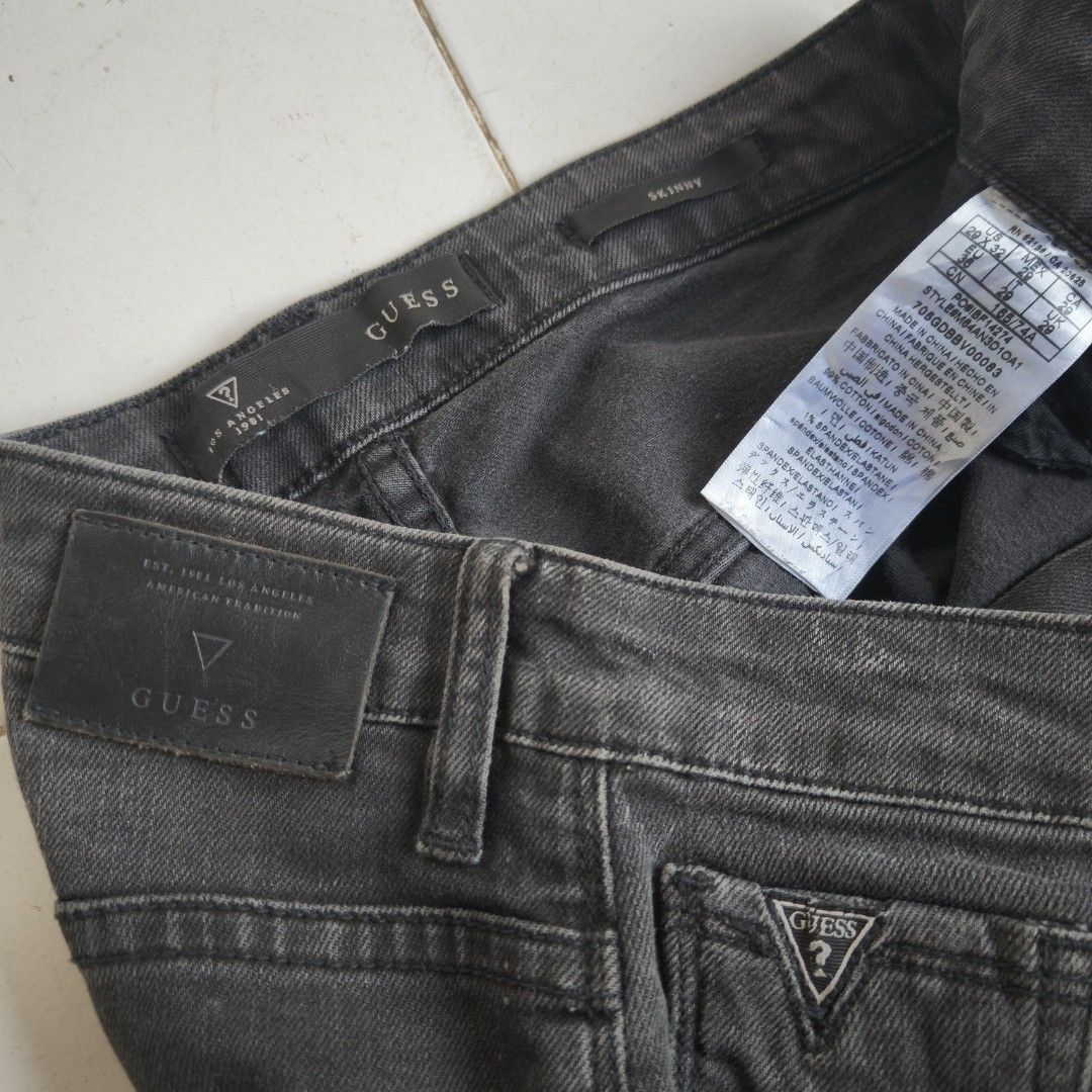 GUESS Biker Jeans Stretchable Size 29-30 (Category: Jeans) located in Tagum. Submitted by rednaxer05 (Listing ID 1467459017, Image 2). Description: - Brand: GUESS - Style: Black biker jeans with ribbed knee panels and zippered cuffs - Size: Tagged 29, fits sizes 29 to 30 comfortably - Material: Stretchable denim - Condition: Clean wash with no fading issues - Perfect for: Adding an edgy vibe to your wardrobe.