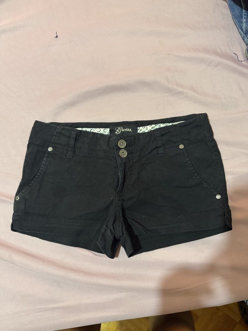 Guess Black Casual Shorts (Category: Shorts) located in Manila. Submitted by maureenn10 (Listing ID 1467540080, Image 1). Description: - Brand: Guess - Color: Classic Black - Fit: Mid-rise - Closure: Double button - Pockets: Front pockets with silver rivet accents and back flap pockets with button closure - Details: Cuffed hems and signature Guess printed waistband lining - Material: Sturdy, durable fabric construction.