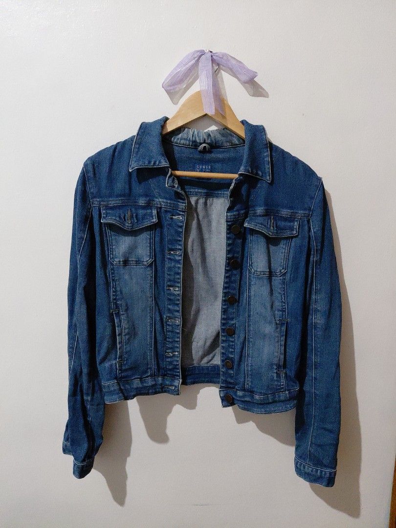 Guess Denim Jacket (Category: Coats, Jackets and Outerwear) located in Tarlac. Submitted by wornwardrobe (Listing ID 1467476372, Image 1). Description: Kindly note that all items are stored at my parents' house and not on hand. Retrieval takes up to 2 weeks before shipping. Please purchase only if you're okay with the wait. Message me to check the next available shipping date! Thank you!.