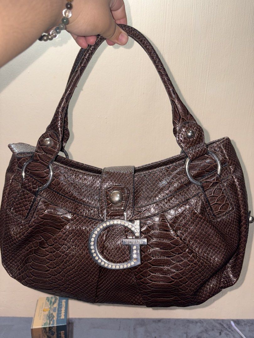 Y2K Guess Vintage Shoulder Bag (Category: Shoulder Bags) located in Angeles City. Submitted by decluterwithmochiii (Listing ID 1467395507, Image 1). Description: in excellent condition considering vintage. Original Guess y2k. large size and very spacious. no issue. Free shipping from Pampanga.