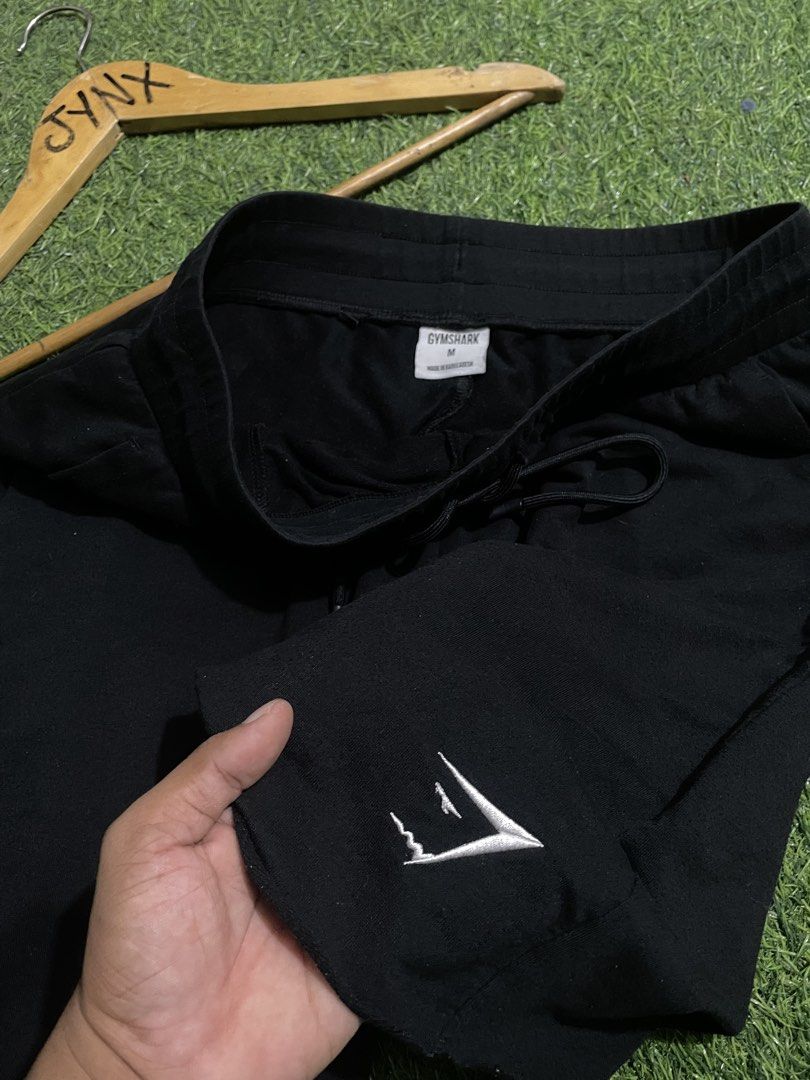 Gymshark Black Shorts Size M (Category: Shorts) located in Las Pinas. Submitted by jynxdefant26140 (Listing ID 1467519751, Image 3). Description: - Brand: Gymshark - Color: Black - Size: Medium - Condition: Great / Like new - Features: Adjustable drawstring waistband, convenient side pockets, and embroidered logo on left leg - Material: Soft, comfortable fabric ideal for workouts or chilling at home - Origin: Made in Bangladesh - Ships fast withi