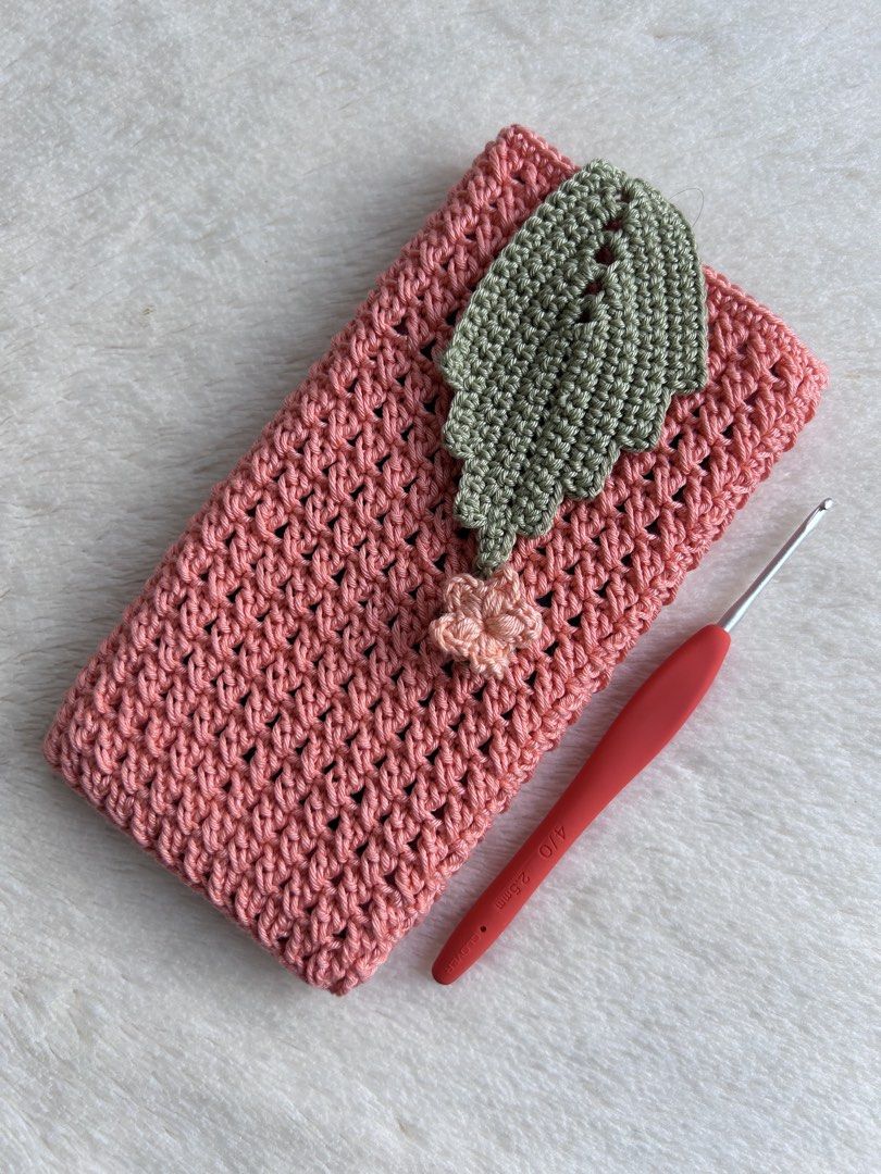 Handmade Crochet Phone Pouch Bag with Leaf Flap (Category: Handmade Craft) located in Caloocan City. Submitted by jaq_0418 (Listing ID 1467564369, Image 3). Description: - Handmade crochet phone pouch designed for standard smartphones - Secure flap closure with a button loop to keep your phone safe - Textured body for a stylish, trendy look - Available in 4 gorgeous colors: Black with Mint Green Leaf, Mustard Yellow, Dusty Pink with Olive Leaf, a