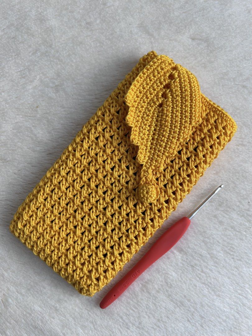 Handmade Crochet Phone Pouch Bag with Leaf Flap (Category: Handmade Craft) located in Caloocan City. Submitted by jaq_0418 (Listing ID 1467564369, Image 2). Description: - Handmade crochet phone pouch designed for standard smartphones - Secure flap closure with a button loop to keep your phone safe - Textured body for a stylish, trendy look - Available in 4 gorgeous colors: Black with Mint Green Leaf, Mustard Yellow, Dusty Pink with Olive Leaf, a