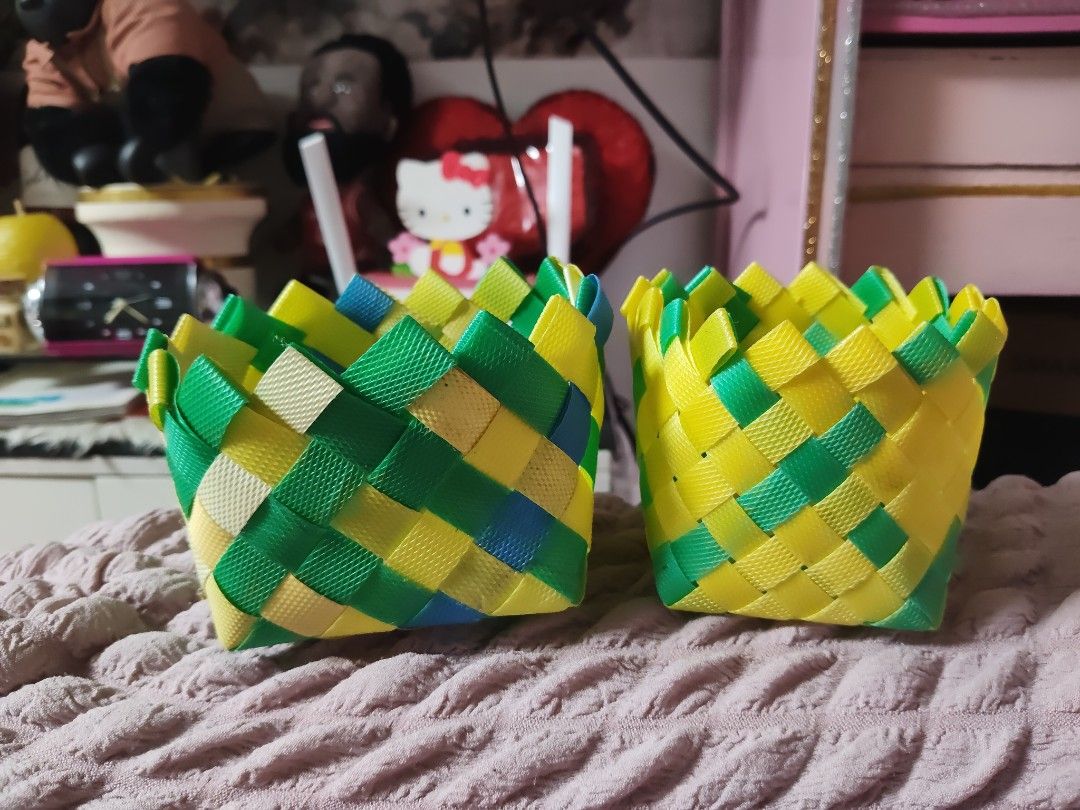 Handmade Woven Plastic Storage Baskets Yellow Green Blue (Category: Storage Boxes & Baskets) located in Pasay City. Submitted by ynamariie (Listing ID 1467467960, Image 1). Description: - Handmade woven baskets made from durable, lightweight plastic straps - Vibrant yellow, green, and blue geometric pattern - Dimensions: approx. 4 to 5 inches across, 3 inches tall - Multi-purpose: ideal for desk supplies, bathroom accessories, and small item orga