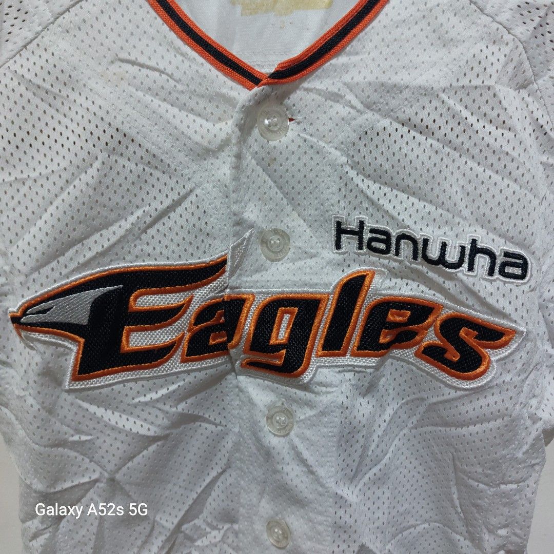 Hanwha Eagles Baseball Jersey White Size 3 (Category: Babies & Kids Fashion) located in Manila. Submitted by hildafonac13322 (Listing ID 1467391933, Image 2). Description: - Official Hanwha Eagles baseball jersey in crisp white - Bold orange and black team embroidery across the chest - Classic button-down front with stylish striped collar and sleeve cuffs - Made from 100% lightweight and breathable polyester mesh fabric - Size: 3 (fits true to st