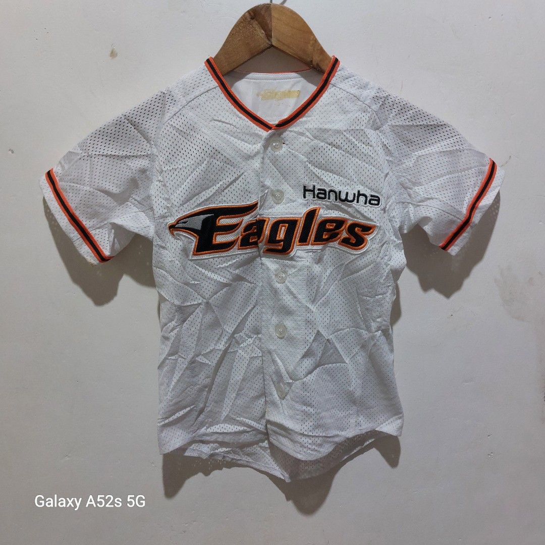 Hanwha Eagles Baseball Jersey White Size 3 (Category: Babies & Kids Fashion) located in Manila. Submitted by hildafonac13322 (Listing ID 1467391933, Image 1). Description: - Official Hanwha Eagles baseball jersey in crisp white - Bold orange and black team embroidery across the chest - Classic button-down front with stylish striped collar and sleeve cuffs - Made from 100% lightweight and breathable polyester mesh fabric - Size: 3 (fits true to st