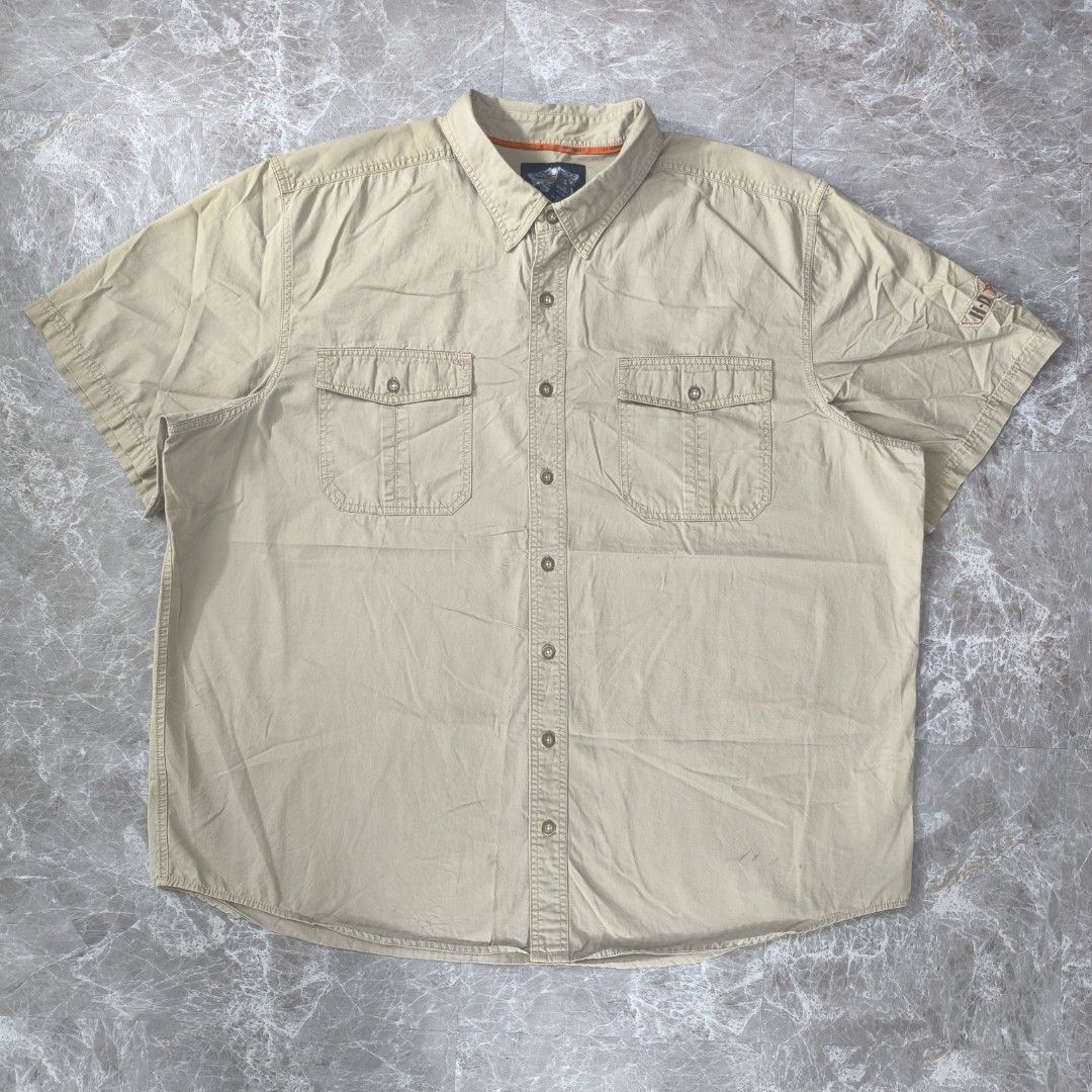 Harley-Davidson Tan Polo Short Sleeve Button-Down Shirt (Category: Tshirts & Polo Shirts ) located in Tabaco. Submitted by thriftkobicolshop (Listing ID 1467407761, Image 2). Description: - Brand: Harley-Davidson - Condition: Good, with issue see photo - Size: 3XL on tag, can fit 4XL - Semi 5XL - Dimes: 31x34-35 - Fabric: Cotton - Color: Tan - Style: Short sleeve button-down shirt - Details: Two chest utility pockets with button flaps, embroidere