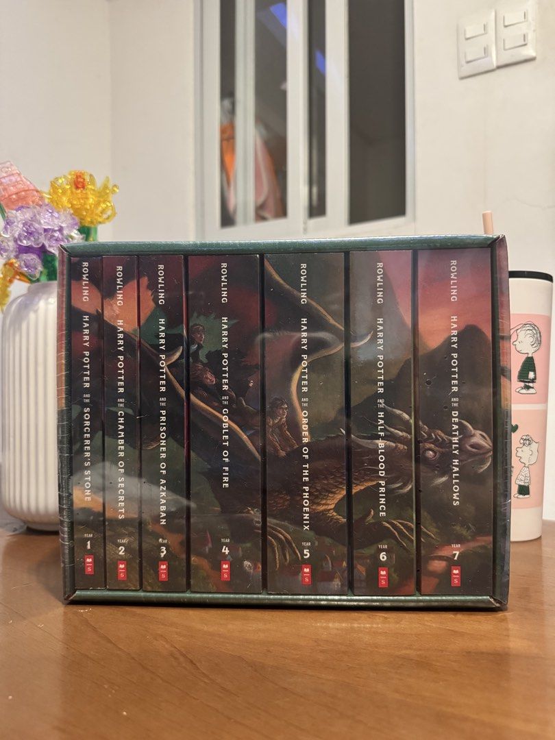 Harry Potter The Complete Series Box Set J.K. Rowling (Category: Storybooks) located in Manila. Submitted by chantyyy0325 (Listing ID 1467406590, Image 2). Description: - Complete Harry Potter book series (Sorcerer's Stone to Deathly Hallows) - Brand new and 100% factory sealed in plastic shrink wrap - Comes with original pictorial slipcase featuring dragon spine artwork - Untouched and unopened, pristine condition - Perfect gift for Potterheads 