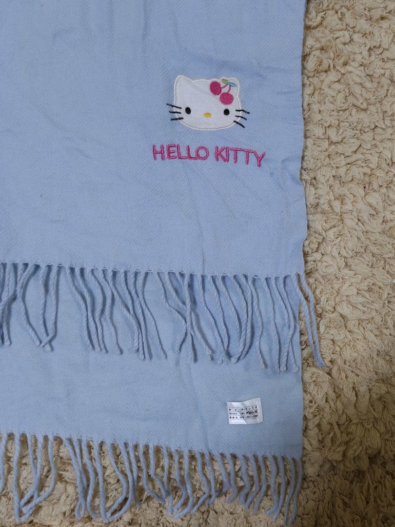 Hello Kitty Blue Winter Scarf with Fringe (Category: Scarves) located in Baguio. Submitted by sky_alexander143 (Listing ID 1467520509, Image 2). Description: - Super soft light blue fleece scarf keeps you warm on cold days - Features an adorable embroidered Kitty face with cute cherry details - Accented with pink embroidered " Hello Kitty" lettering - Finished with stylish fringe ends.