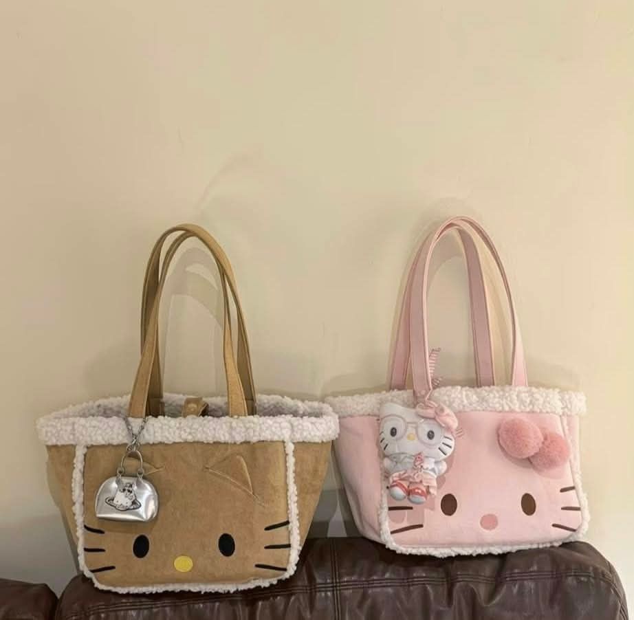 Hello Kitty Faux Shearling Tote Bag with Charm (Category: Tote Bags) located in Manila. Submitted by breansfinds (Listing ID 1467484704, Image 3). Description: COD NATIONWIDE - Adorable brown suede-like Kitty tote bag with fluffy white shearling trim - Features embroidered yellow nose and black whiskers on the front - Soft and cozy plush texture with a roomy interior for all your daily essentials - Comes with comfortable dual shoulder straps - In
