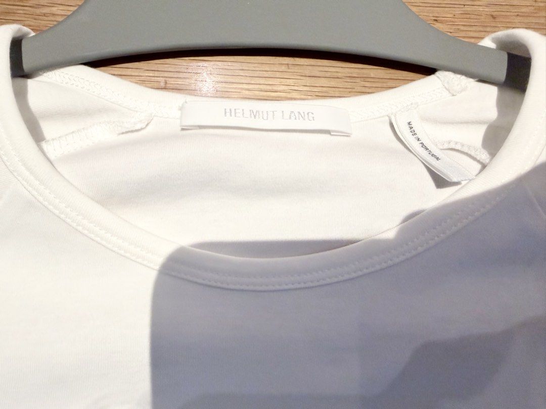 Helmut Lang Zip Sleeve T-Shirt White (Category: Shirts) located in Makati City. Submitted by beehive03 (Listing ID 1467459939, Image 1). Description: Worn once Excellent condition - Brand: Helmut Lang -Fits small to medium (tag size says XL but fits small because it’s a baby tee) - Color: Crisp White - Material: 100% Premium Cotton - Fit: Regular fit with crew neck - Details: Unique zipper accents on short sleeves - Origin: Made in Portugal - Car